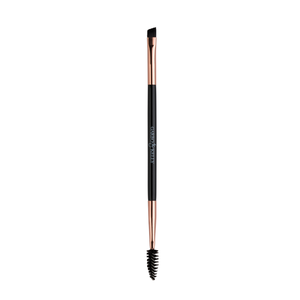 Garbo and Kelly brow brush with angled bristles for precise eyebrow grooming and shaping.