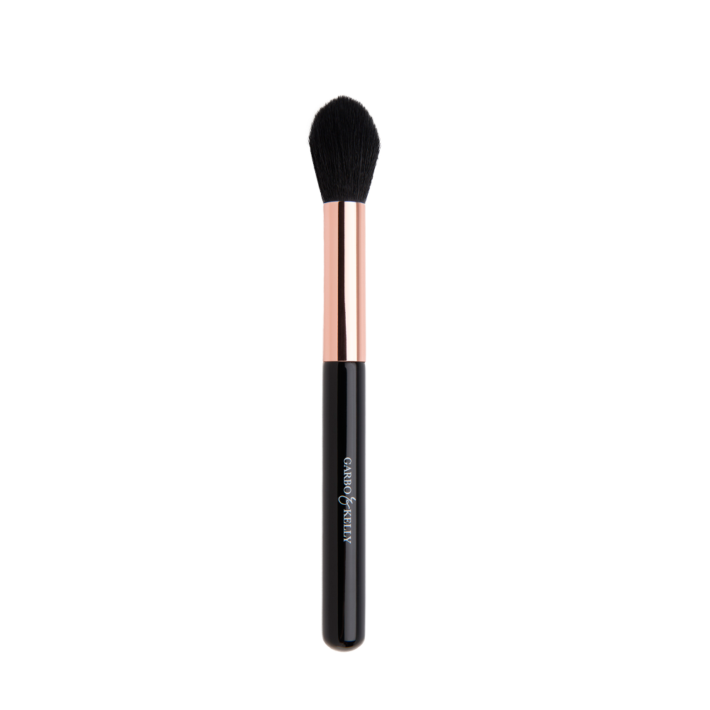 Garbo and Kelly defining contour brush with tapered bristles for precise facial contouring and blending.