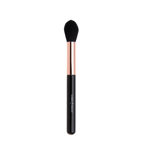 Garbo and Kelly defining contour brush with tapered bristles for precise facial contouring and blending.