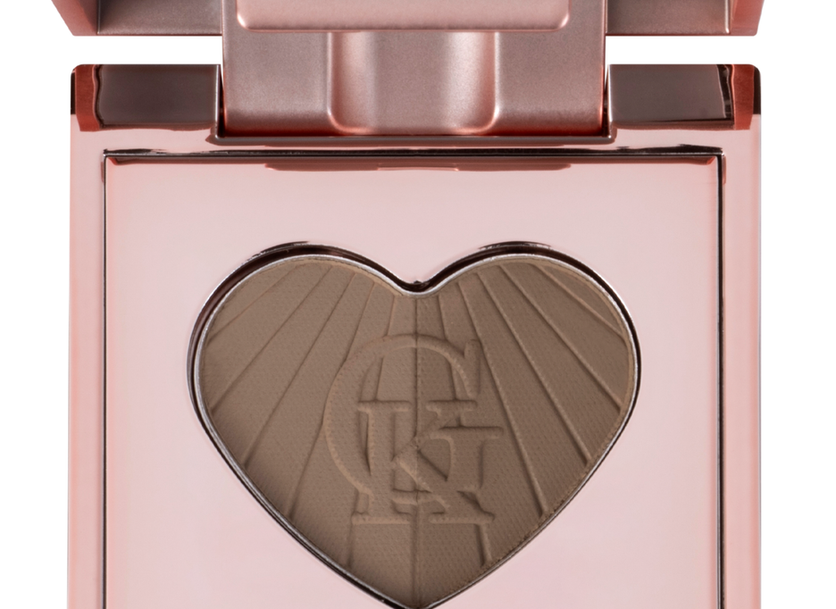 Close-up of Garbo and Kelly talc-free brow powder in a compact, showing the soft, natural shades for eyebrow shaping and filling.