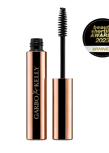 Close-up of Garbo & Kelly Brow Gel tube with the product label and applicator brush visible.