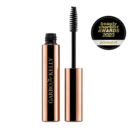 Close-up of Garbo & Kelly Brow Gel tube with the product label and applicator brush visible.