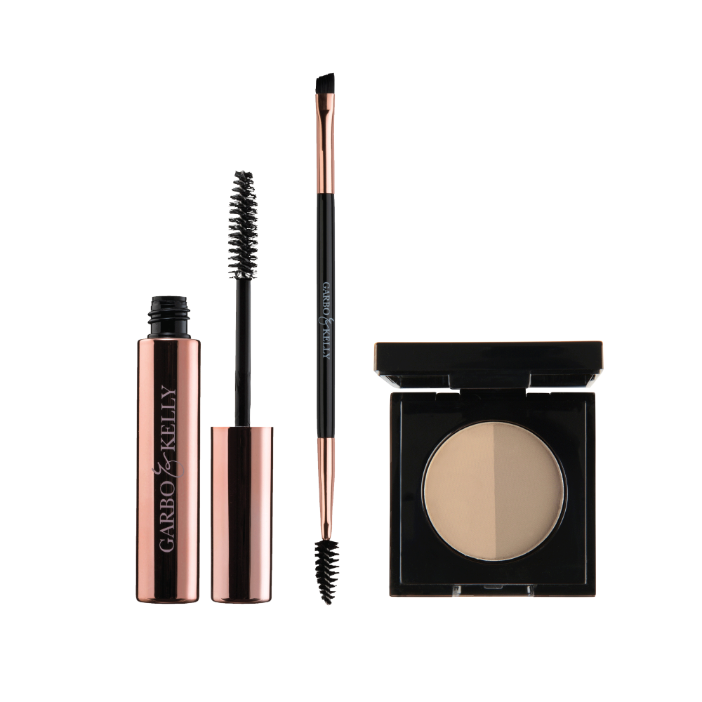 Garbo and Kelly Brow Magic Set featuring eyebrow powders, pencils, and tools for shaping and defining brows.