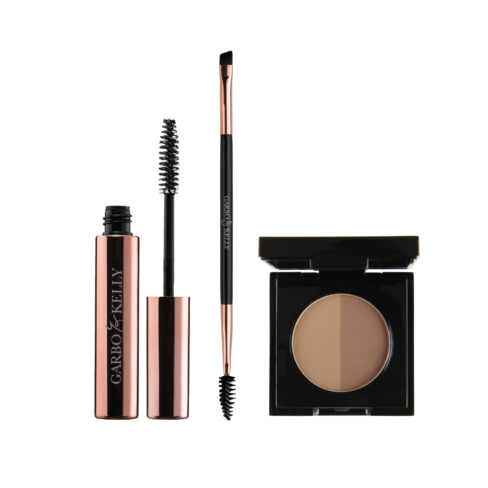 Garbo and Kelly Brow Magic Set featuring eyebrow powders, brushes, and tools for shaping and defining brows.