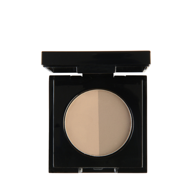 Close-up of Garbo and Kelly Brow Powder in a compact, showing the finely milled powder and applicator brush inside.