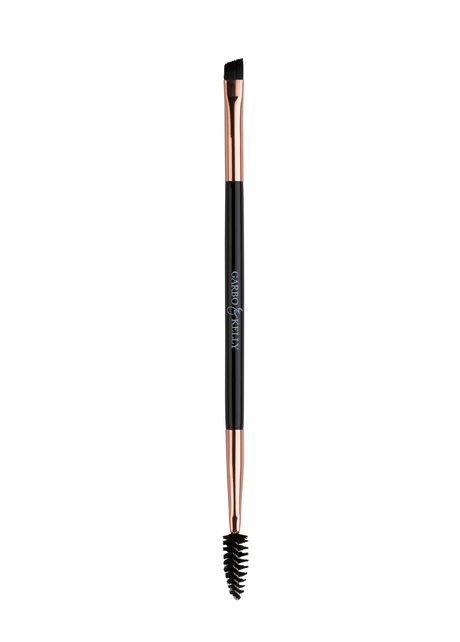 Garbo and Kelly brow brush with angled bristles for precise eyebrow grooming and shaping.